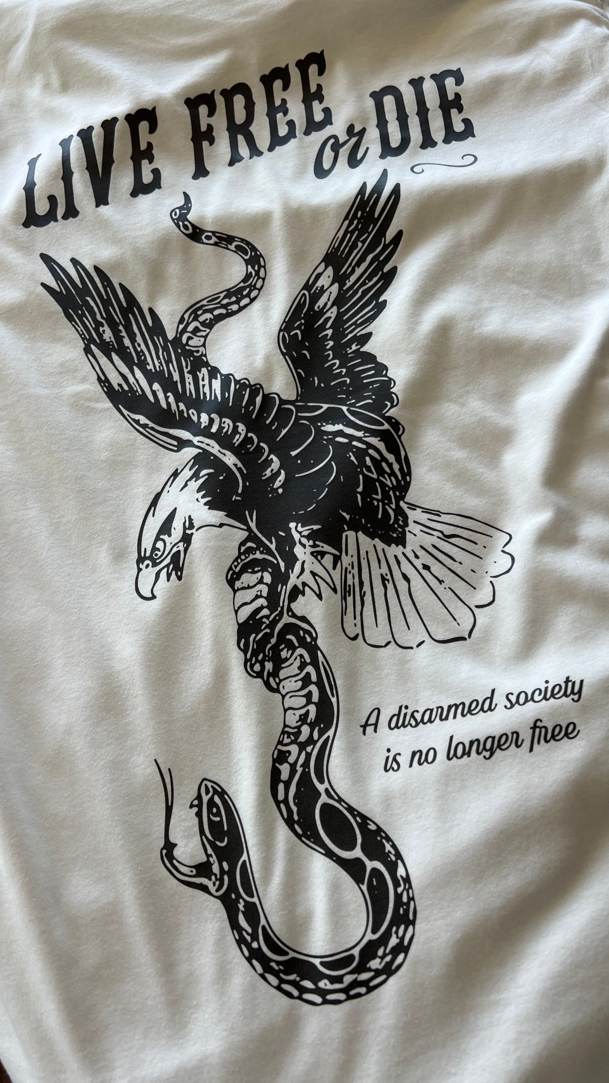 White Carbine Cowboys Live Free or Die tee back. A disarmed society is no longer free.