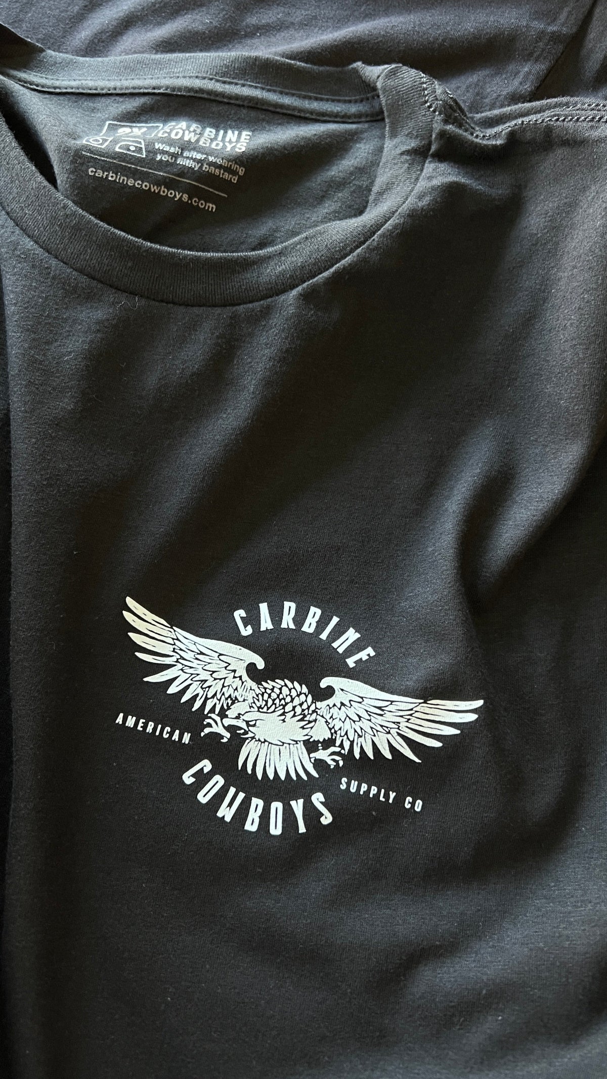 Black Carbine Cowboys tee front. American-Made, Tradition-Inspired, Freedom-Worn.